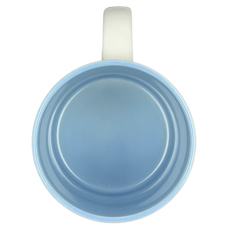 Top view of a blue ceramic Rick poetry name mug featuring a smooth finish