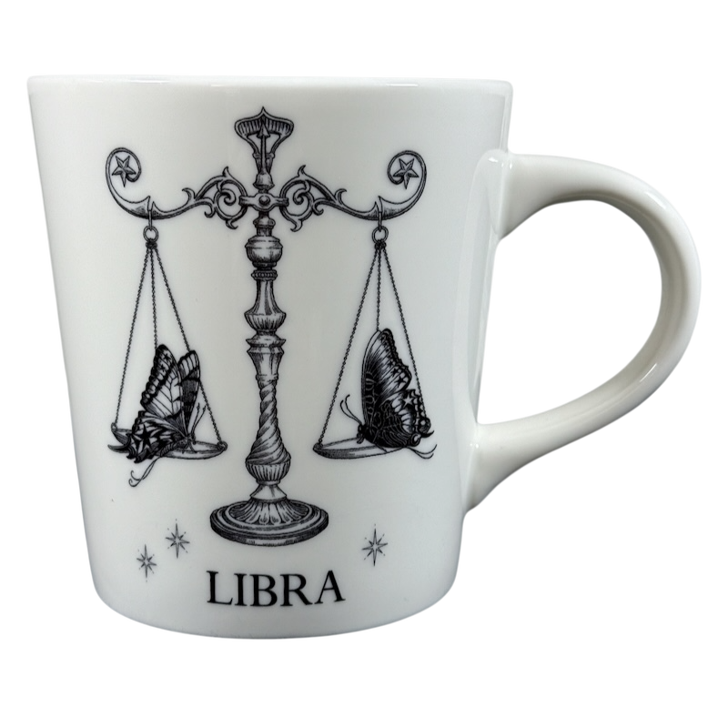 White ceramic Rory Dobner astrology mug featuring Libra zodiac symbol with butterfly scales design