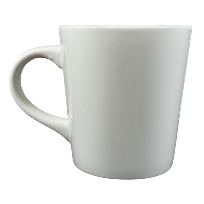 Plain white ceramic Rory Dobner astrology mug with a large handle on a black background