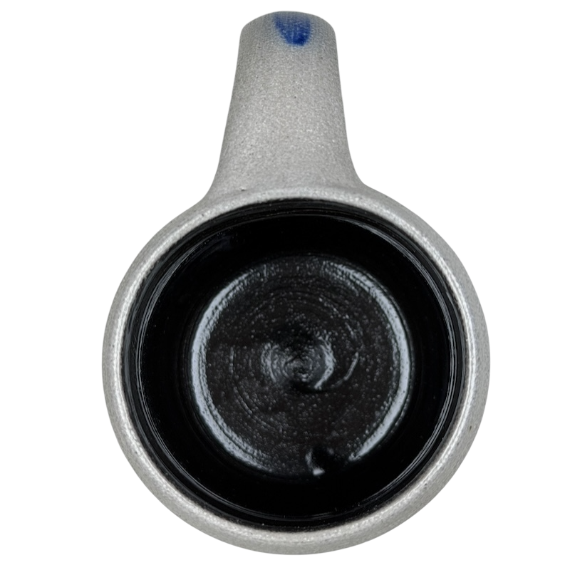 Inside view of God Bless America salt glazed Rowe Pottery mug with a smooth black finish