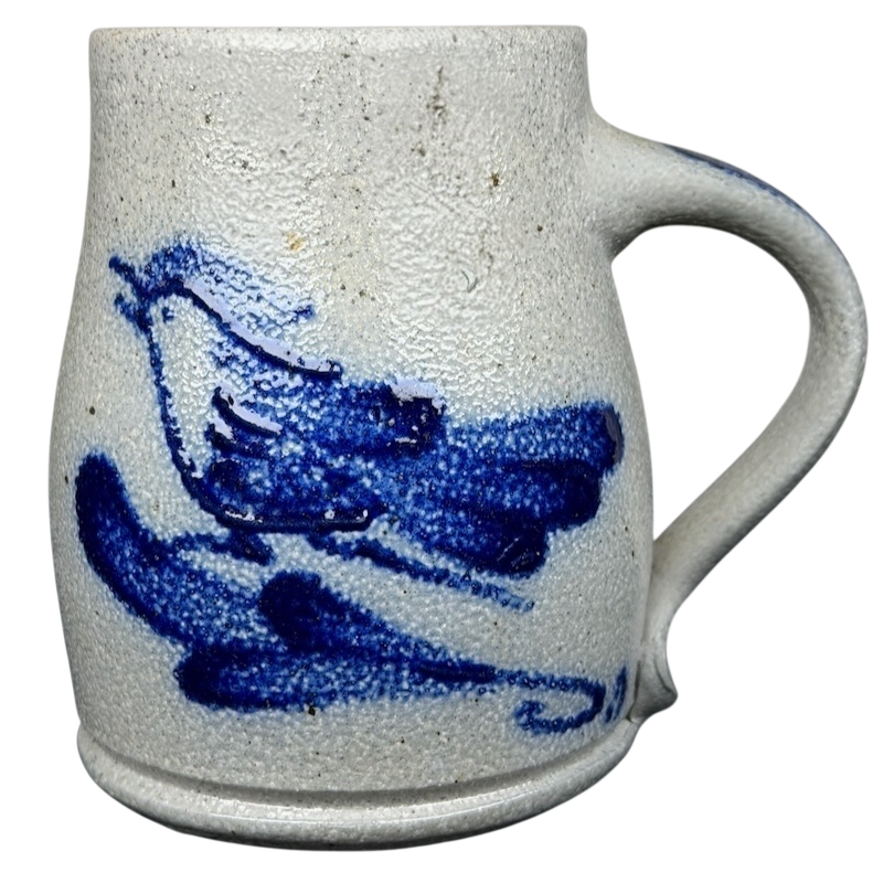 Rowe Pottery Works blue bird mug with textured surface and hand-painted bird design