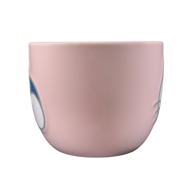 Side view of a pink Hello Kitty collectible Sanrio mug with cute character design