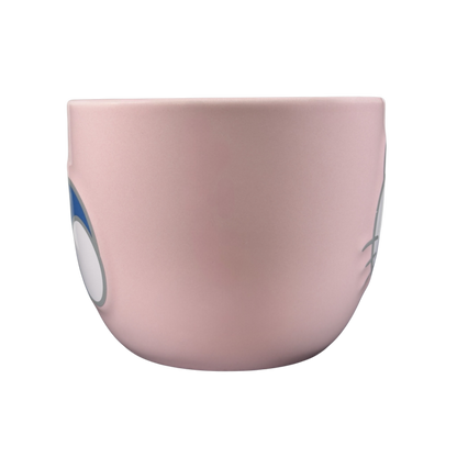 Side view of a pink Hello Kitty collectible Sanrio mug with cute character design
