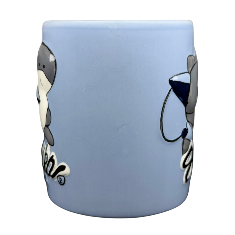 Sharka Surf Co shark mug in blue featuring playful shark designs and a fun beach theme