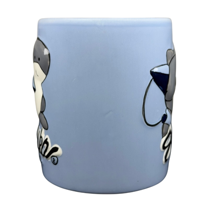 Sharka Surf Co shark mug in blue featuring playful shark designs and a fun beach theme