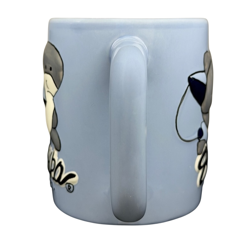 Light blue Sharka Surf Co shark mug featuring a cute shark design for ocean lovers
