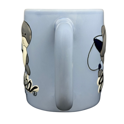 Light blue Sharka Surf Co shark mug featuring a cute shark design for ocean lovers