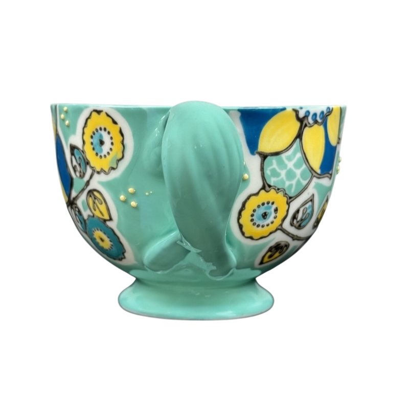 Anthropologie Elka Ayaka green floral pedestal mug ceramic turquoise mug with yellow blue floral pattern and gold dots