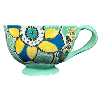 Anthropologie Elka Ayaka green floral pedestal mug handpainted ceramic cup with yellow and blue flowers