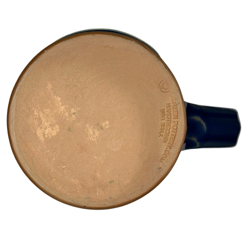 Bottom view of Simply Divine Bed and Breakfast Deneen mug showcasing handcrafted details and earthy glaze