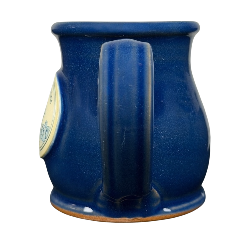 Simply Divine Bed and Breakfast Deneen mug in deep blue with a curved handle and classic design