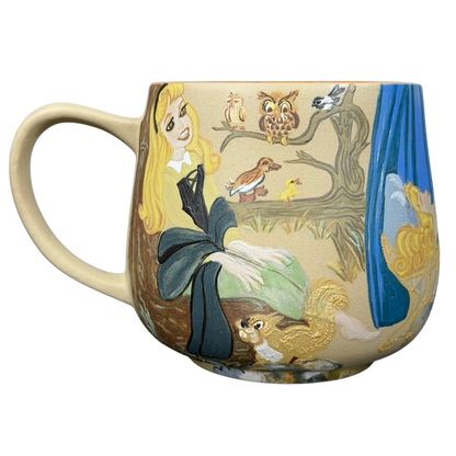 Sleeping Beauty hand-painted pottery mug featuring Aurora and woodland creatures in vibrant colors