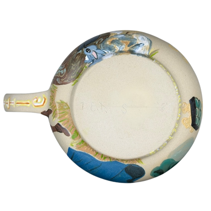 Sleeping Beauty hand-painted pottery mug featuring intricate designs and vibrant colors