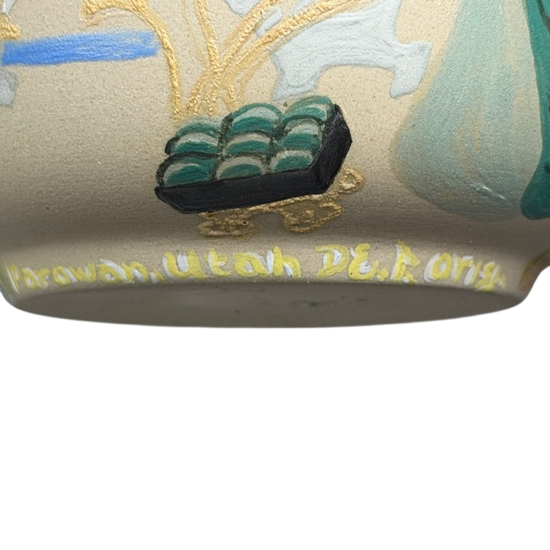 Sleeping Beauty hand-painted pottery mug featuring intricate floral designs and vibrant colors