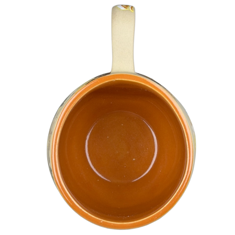 Top view of a Sleeping Beauty hand-painted pottery mug with a vibrant orange interior