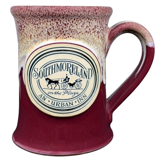 Southmoreland on the Plaza Deneen mug featuring a decorative logo and a red glaze finish