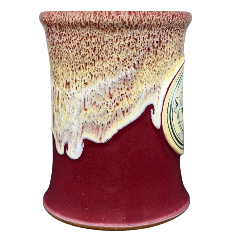 Southmoreland On The Plaza Deneen mug featuring a unique glaze design in burgundy and cream colors