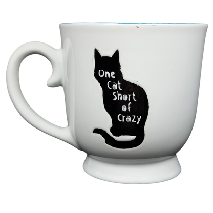 One Cat Short Of Crazy Mug by Spectrum Designz featuring a silhouette of a cat