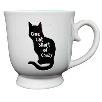 One Cat Short Of Crazy Mug Spectrum Designz featuring a black cat silhouette on a white ceramic cup