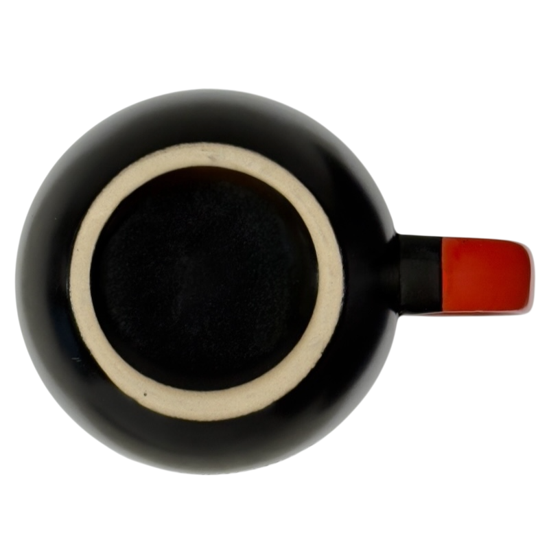 Top view of Spectrum Designz Day of the Dead cat mug black glaze with red handle on black background