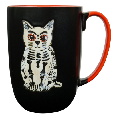 Spectrum Designz Day of the Dead cat mug black ceramic with orange interior and handle and white sugar skull cat design