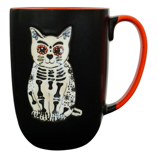 Spectrum Designz Day of the Dead cat mug black ceramic with orange interior and handle and white sugar skull cat design