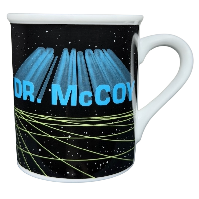 Dr. McCoy Star Trek vintage mug featuring a cosmic design with vibrant lettering and a classic shape