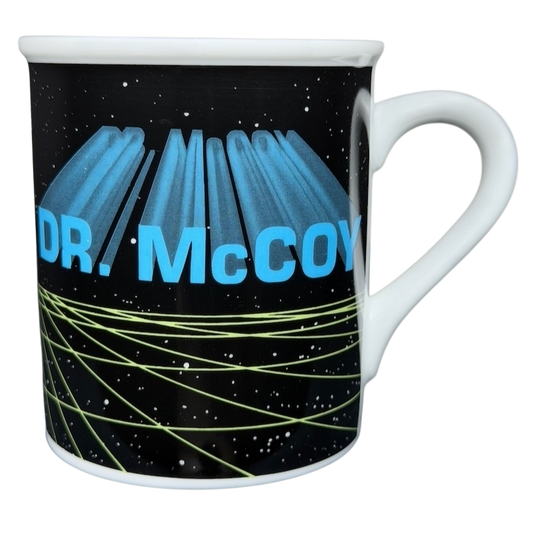 Dr. McCoy Star Trek vintage mug featuring a cosmic design with vibrant lettering and a classic shape