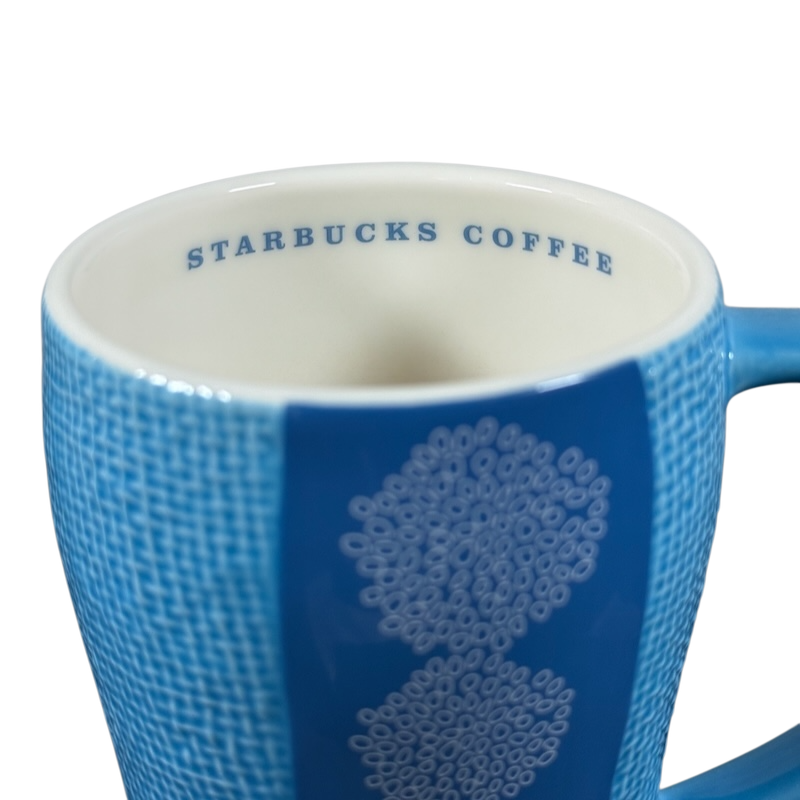 Starbuck svintage woven texture coffee mug by Starbucks in light blue with textured design and logo inside