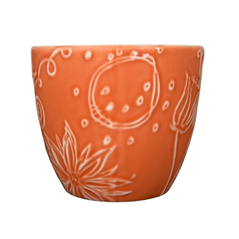 2006 Starbucks embossed coral flowers leaves mug with intricate floral designs and a vibrant coral color