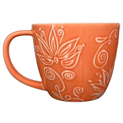 2006 Starbucks embossed coral flowers leaves mug featuring intricate floral designs in coral color