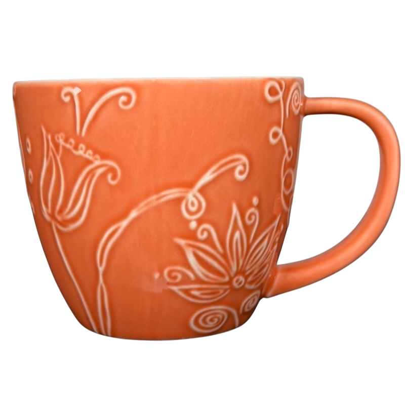 2006 Starbucks embossed coral flowers leaves mug with intricate floral designs in a vibrant coral color
