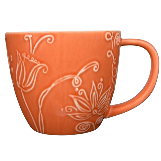 2006 Starbucks embossed coral flowers leaves mug with intricate floral designs in a vibrant coral color