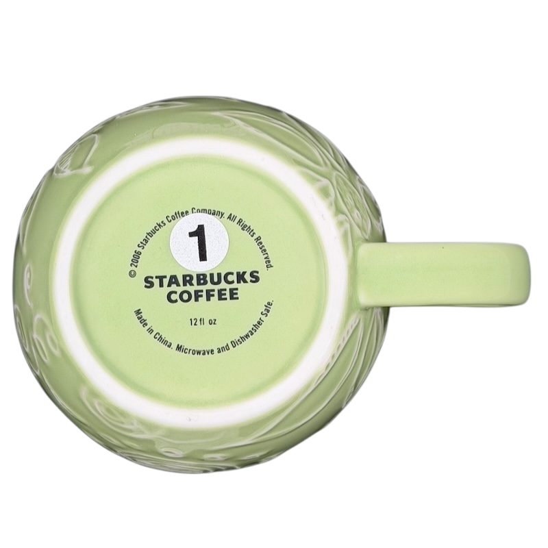 2006 Starbucks embossed green flowers hearts mug with a unique textured design