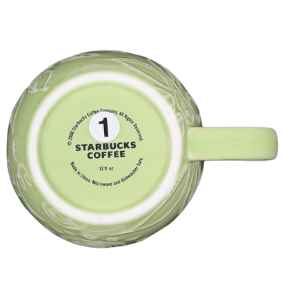 2006 Starbucks embossed green flowers hearts mug with a unique textured design