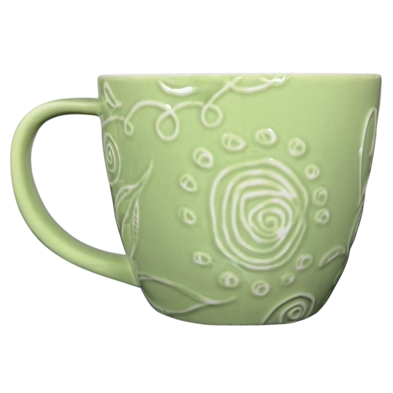 2006 Starbucks embossed green flowers hearts mug featuring a decorative floral design