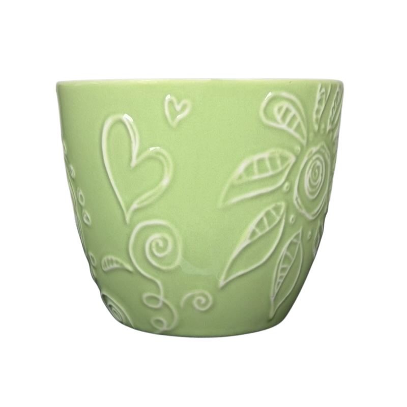 2006 Starbucks embossed green flowers hearts mug with intricate designs and a soft green finish