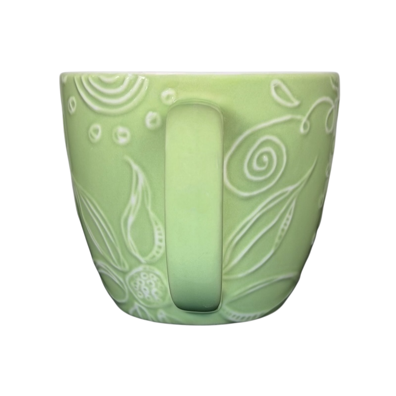 2006 Starbucks embossed green flowers hearts mug featuring intricate floral designs