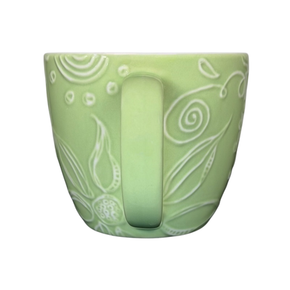 2006 Starbucks embossed green flowers hearts mug featuring intricate floral designs