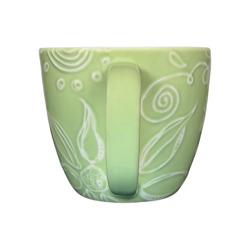 2006 Starbucks embossed green flowers hearts mug with intricate floral design and cozy shape