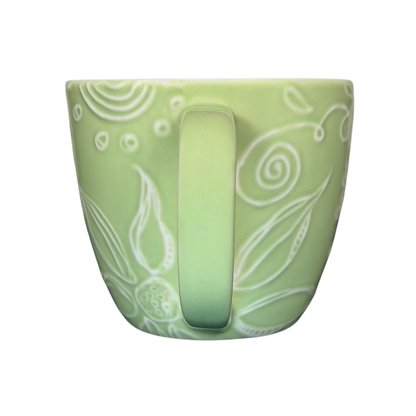 2006 Starbucks embossed green flowers hearts mug with intricate floral design and cozy shape