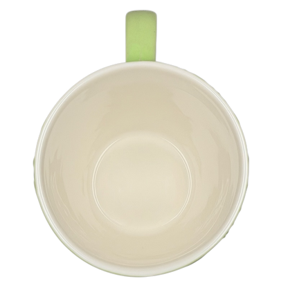2006 Starbucks embossed green flowers hearts mug viewed from above, featuring a simple design