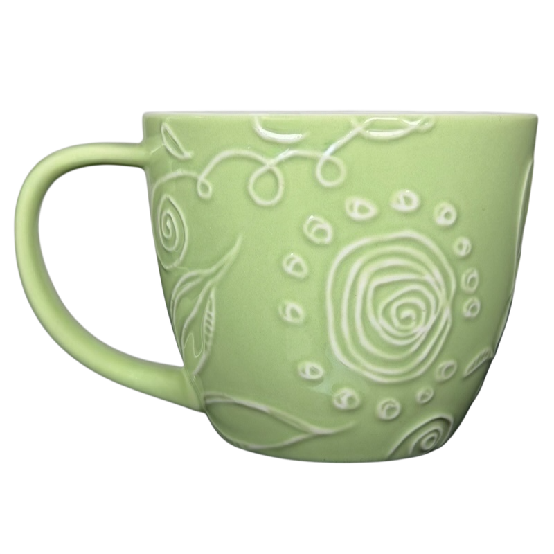2006 Starbucks embossed green flowers hearts mug with intricate floral patterns