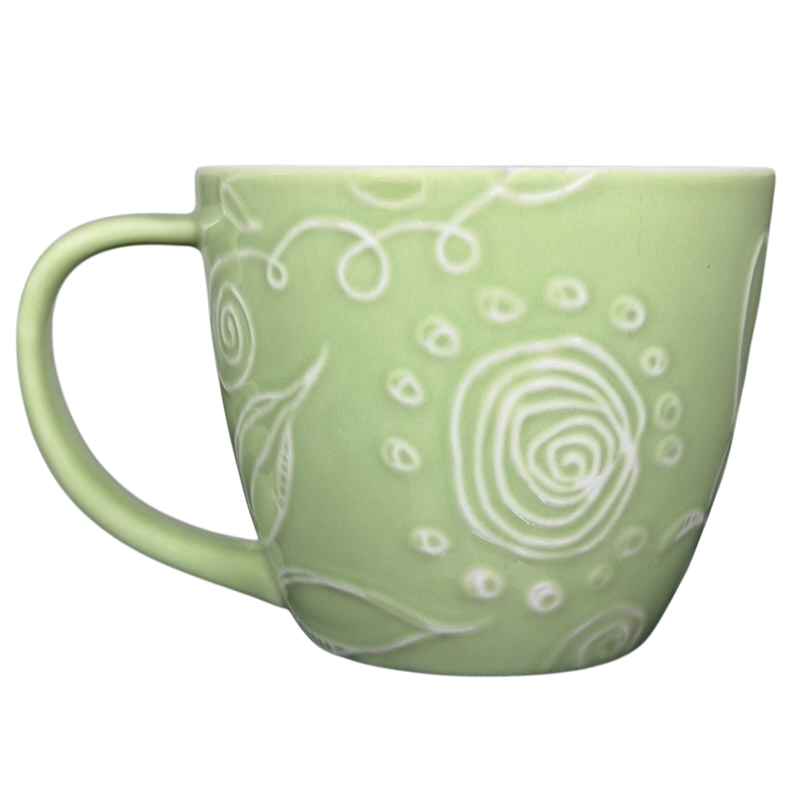 2006 Starbucks embossed green flowers hearts mug with unique textured design and comfortable handle