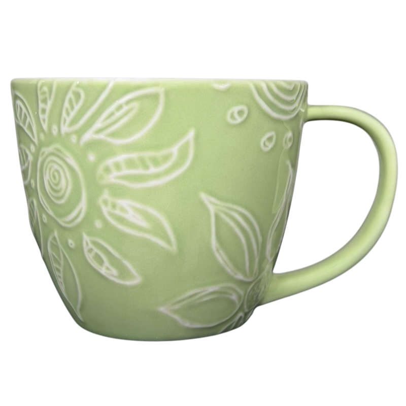 2006 Starbucks embossed green flowers hearts mug featuring a floral design with delicate details