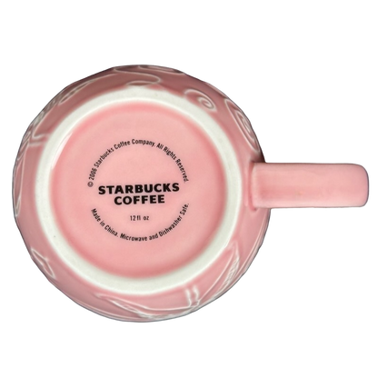 2006 Starbucks embossed pink flowers hearts mug featuring delicate floral designs and classic Starbucks logo