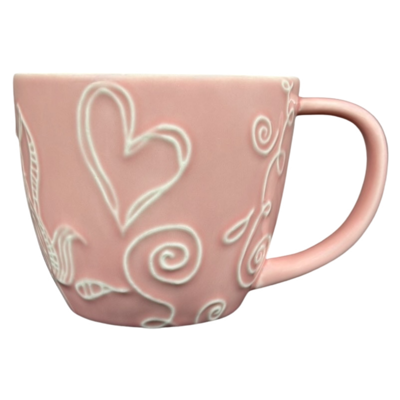 2006 Starbucks embossed pink flowers hearts mug with intricate designs and a stylish handle