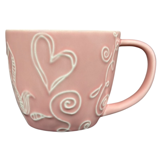 2006 Starbucks embossed pink flowers hearts mug with intricate designs and a stylish handle