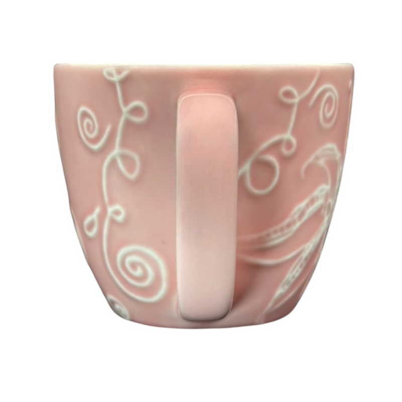 2006 Starbucks embossed pink flowers hearts mug featuring unique floral designs and a simple handle
