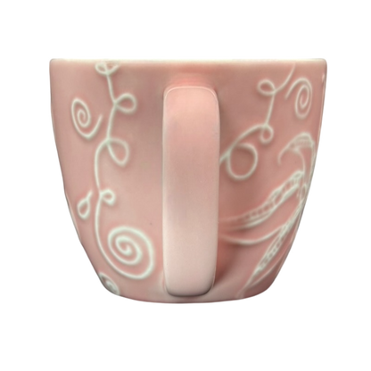 2006 Starbucks embossed pink flowers hearts mug featuring unique floral designs and a simple handle